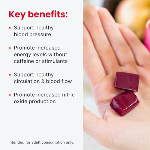 Hand holding two gummies with health benefits listed: supports healthy blood pressure, increases energy, supports circulation and nitric oxide production.